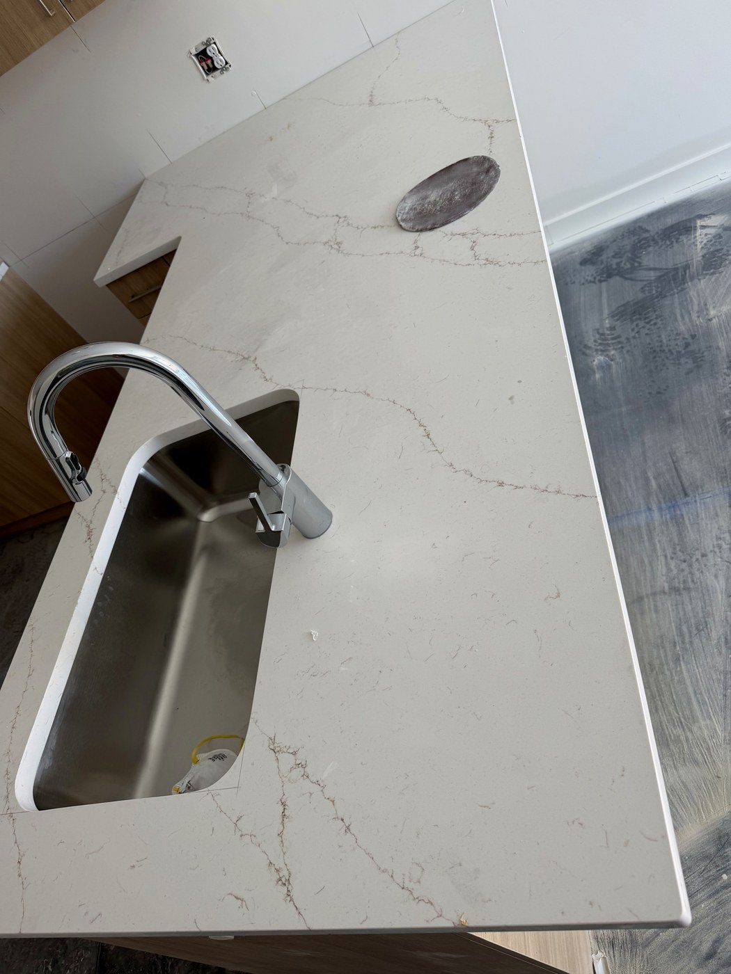 White stone countertop with sink cutout