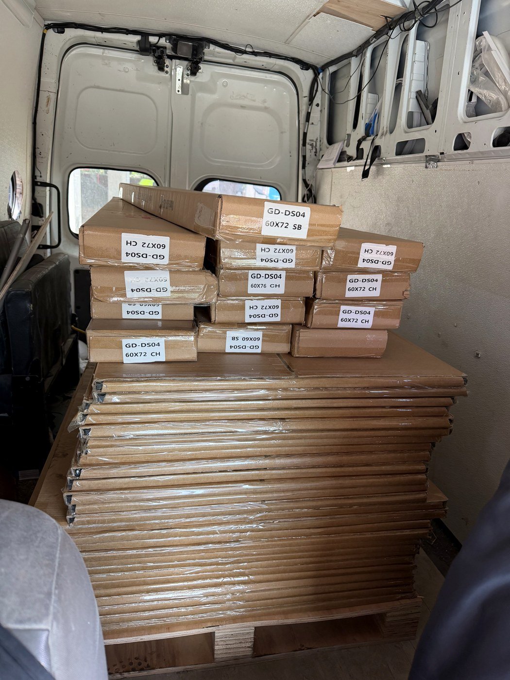 Packaged shower glass doors inside delivery van