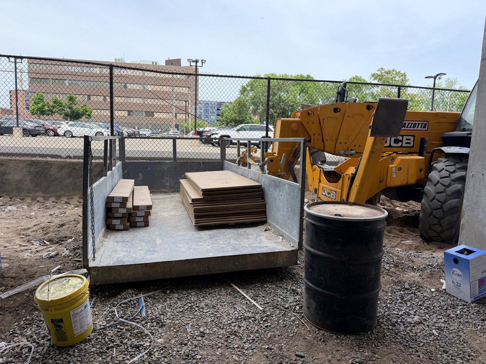 Shower glass door packages staged at job site