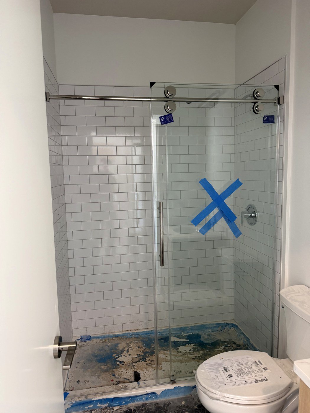 Installed frameless shower glass door